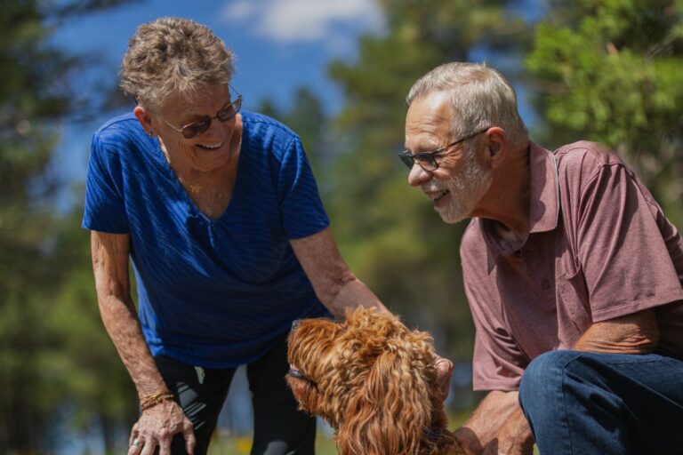 Civitas Senior Living | Residents petting their dog on a walk