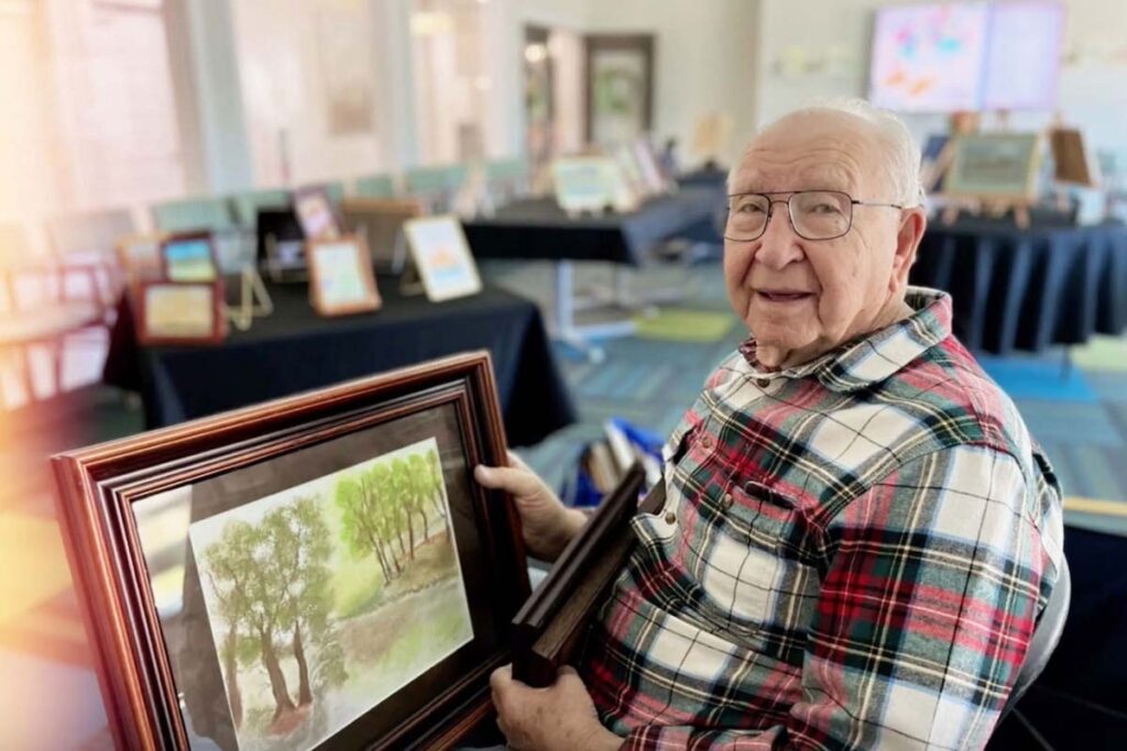 Ariel Pointe of Sachse | Bill M showing his pastel paintings