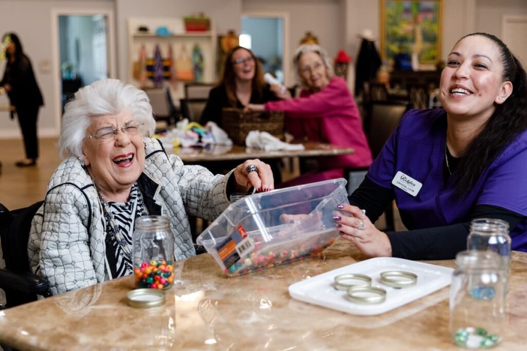 Civitas Senior Living | Senior resident laughing and playing games