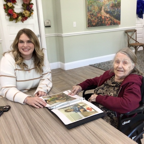 Ariel Pointe | Team member and resident looking at photos