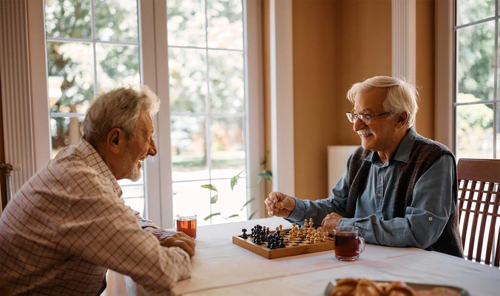 Elk Creek Two senior men playing a game of chess