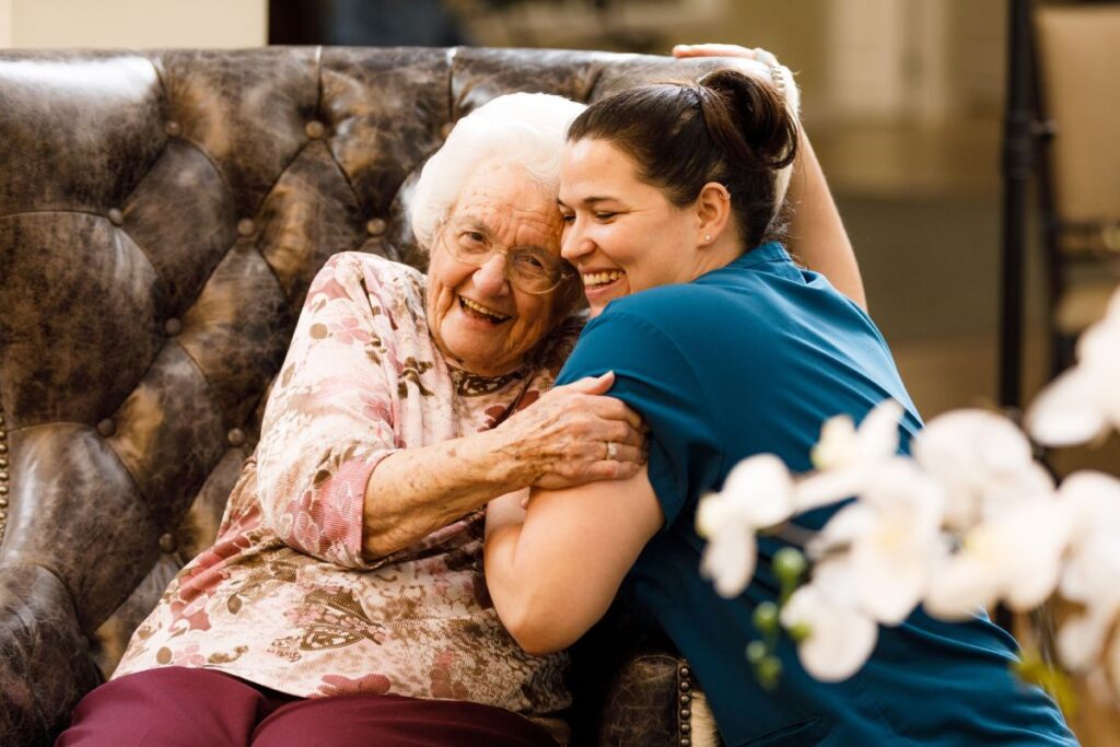 Civitas Senior Living | Resident and caregiver embracing