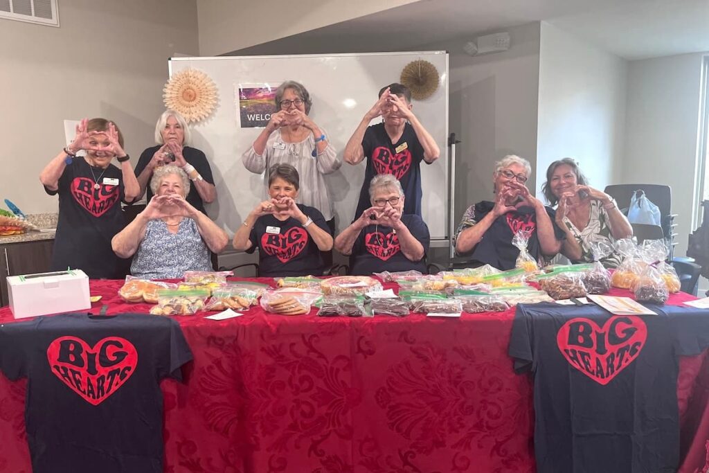 Ledgestone Senior Living | Big hearts club making heart hands