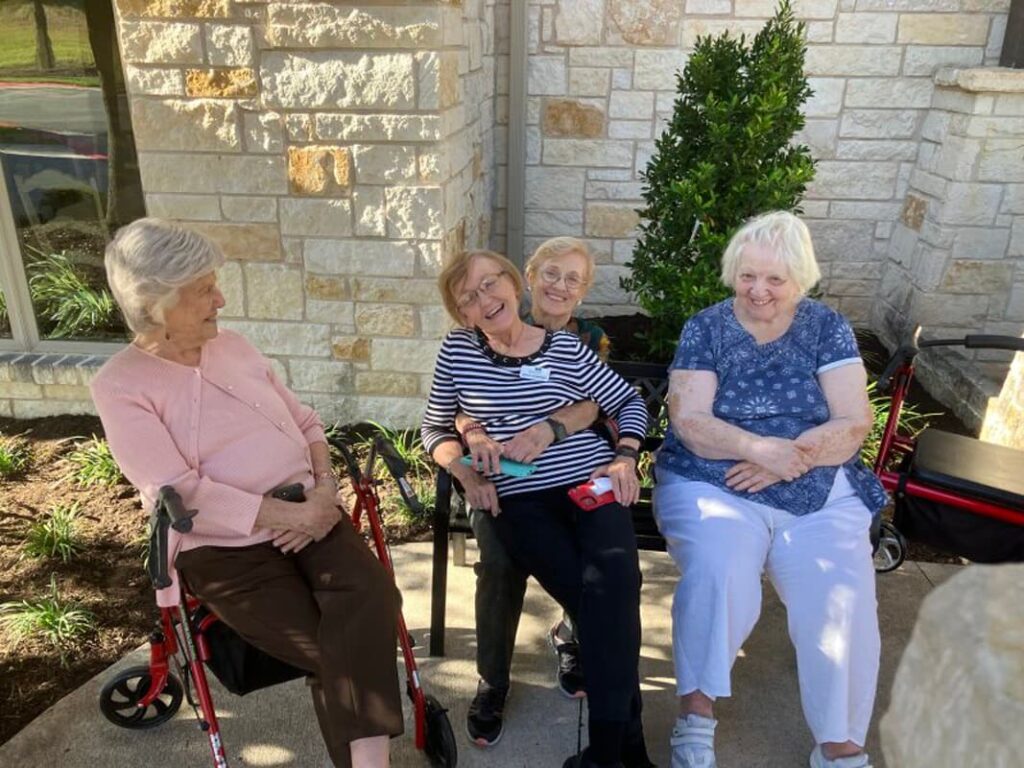 Ledgestone Senior Living | Senior friends laughing outside