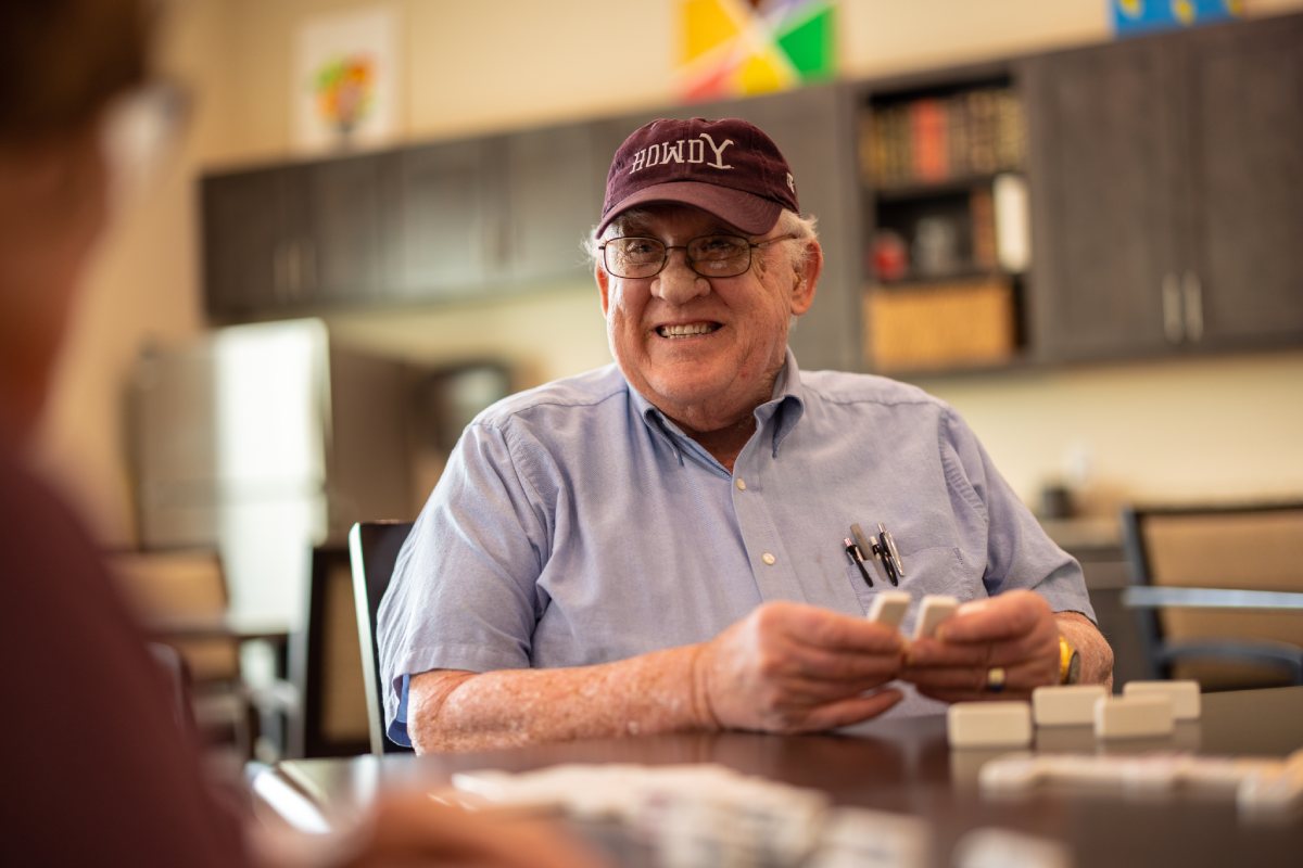 Civitas Senior Living | Seniors playing dominoes