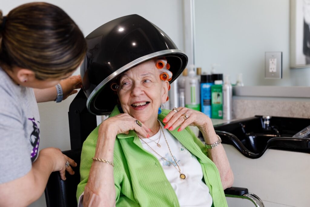 Civitas Senior Living | Senior resident getting her hair done