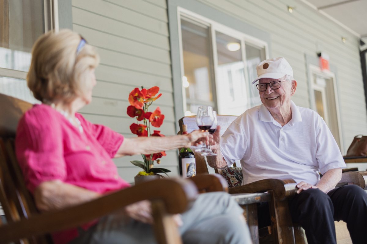 Civitas Senior Living | Seniors having wine on a patio