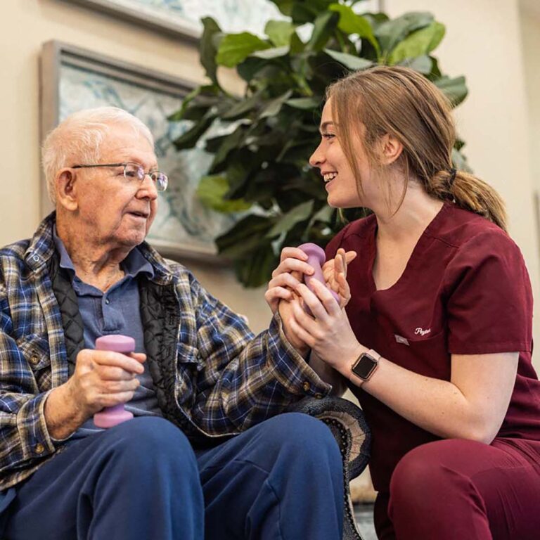 Civitas Senior Living | Senior resident exercising with caregiver