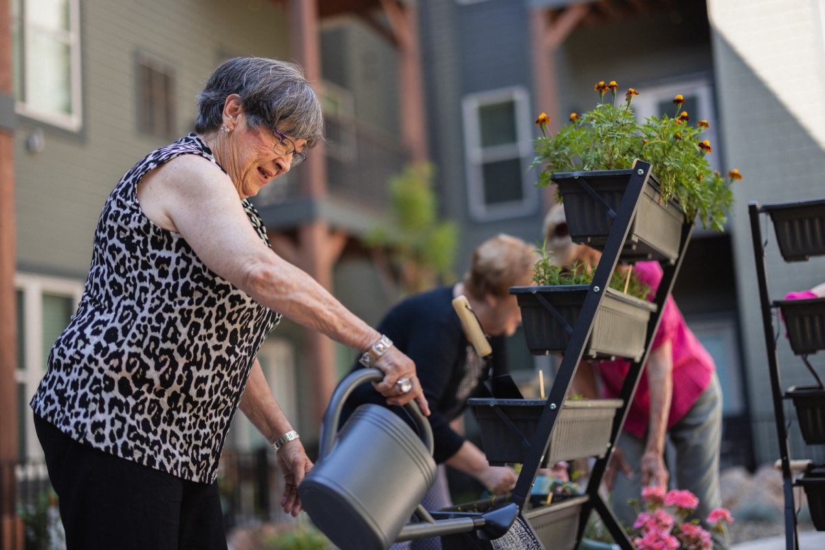 Civitas Senior Living | Seniors enjoying working in a garden