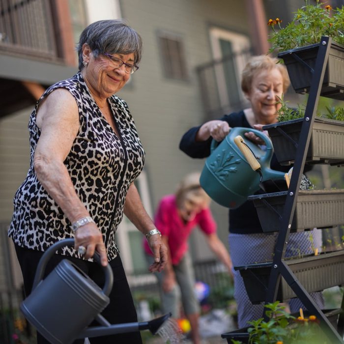 The Bluffs of Flagstaff | Senior residents watering flowers together