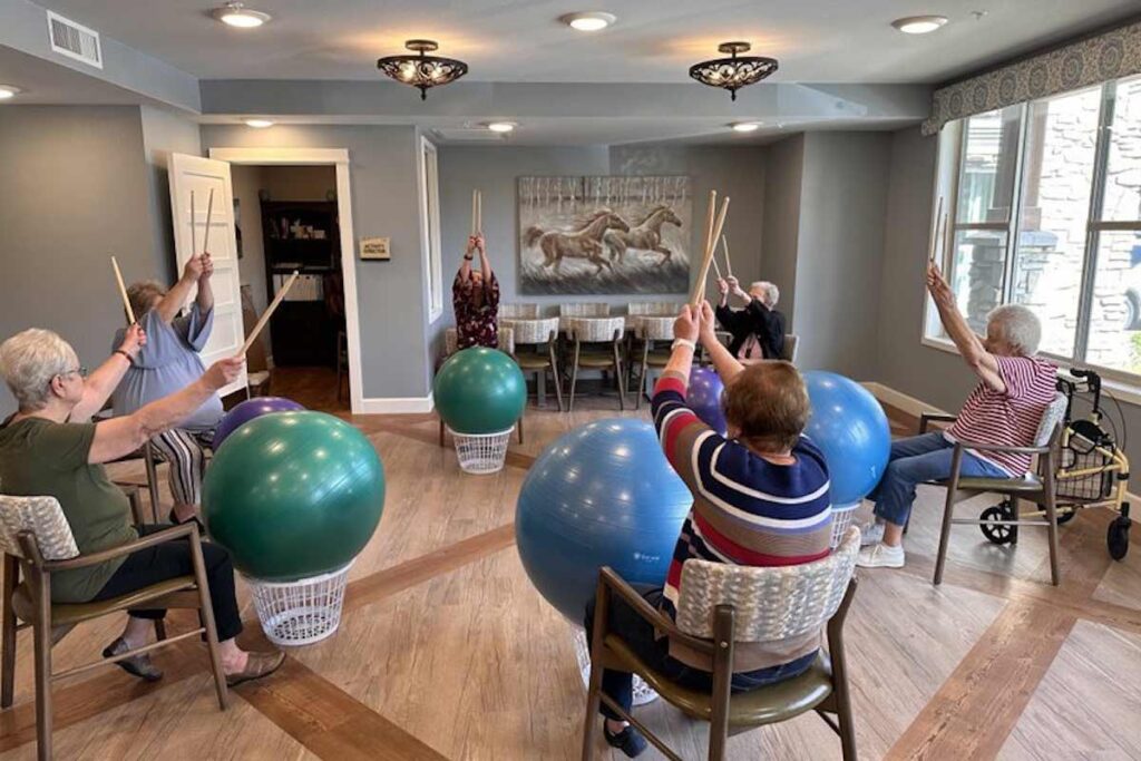 Civitas | Seniors participating in drum exercise to stay healthy and regulate blood pressure