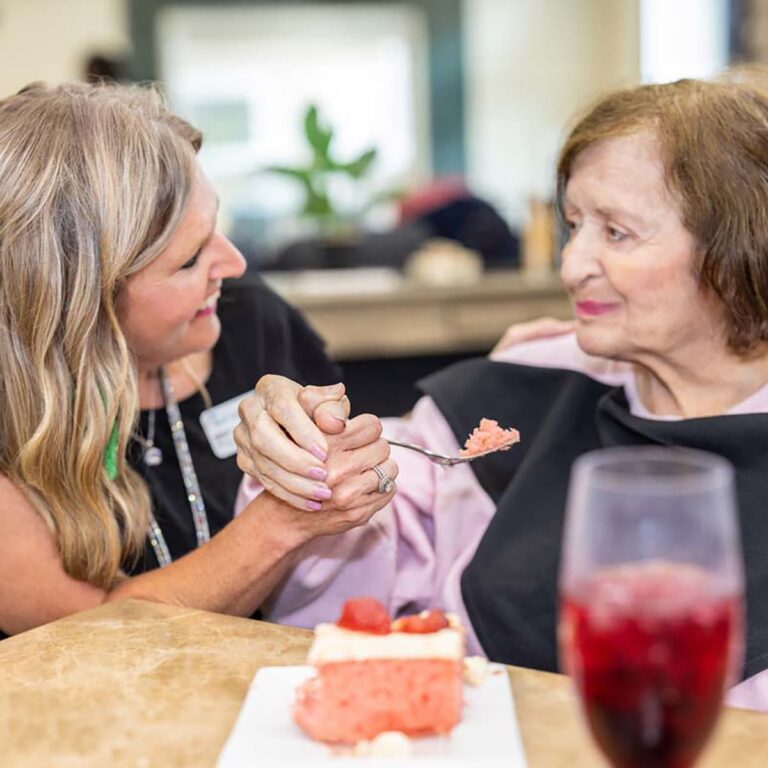 Civitas Senior Living | Senior resident eating with caregiver