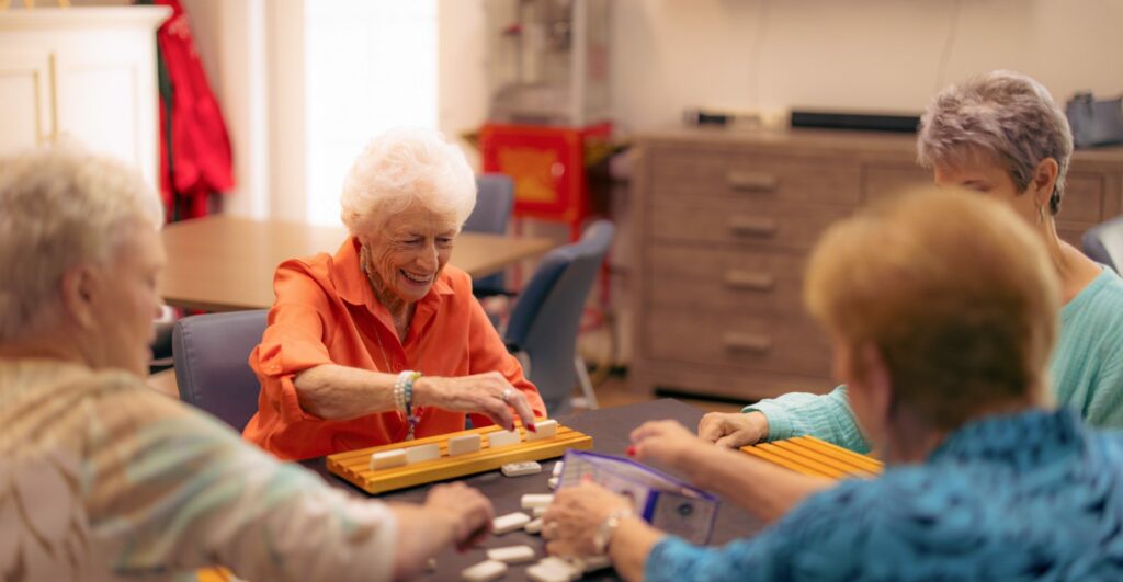 The Hamptons of Tyler | Group of seniors playing dominoes