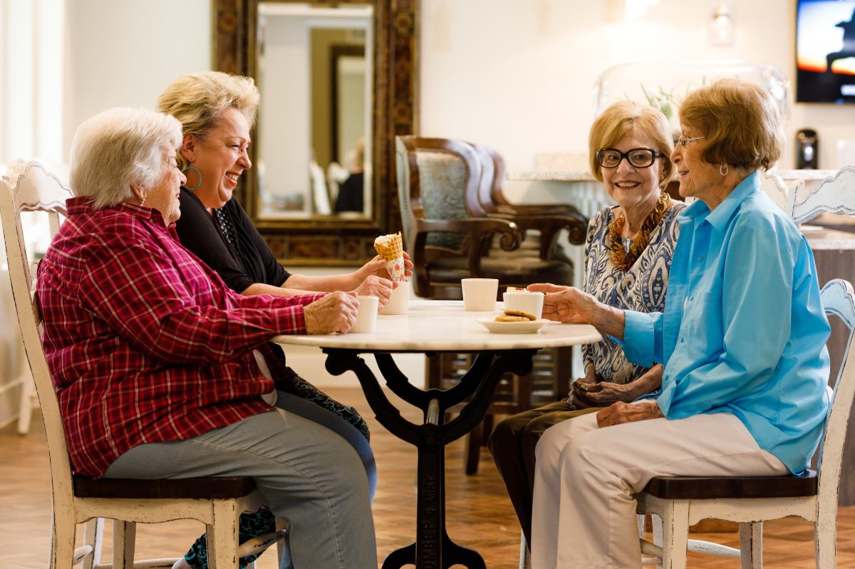 Civitas Senior Living | Seniors talking at a table