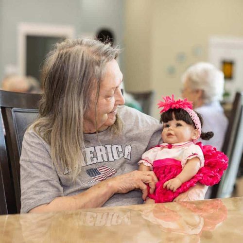 Civitas Senior Living | Resident with doll