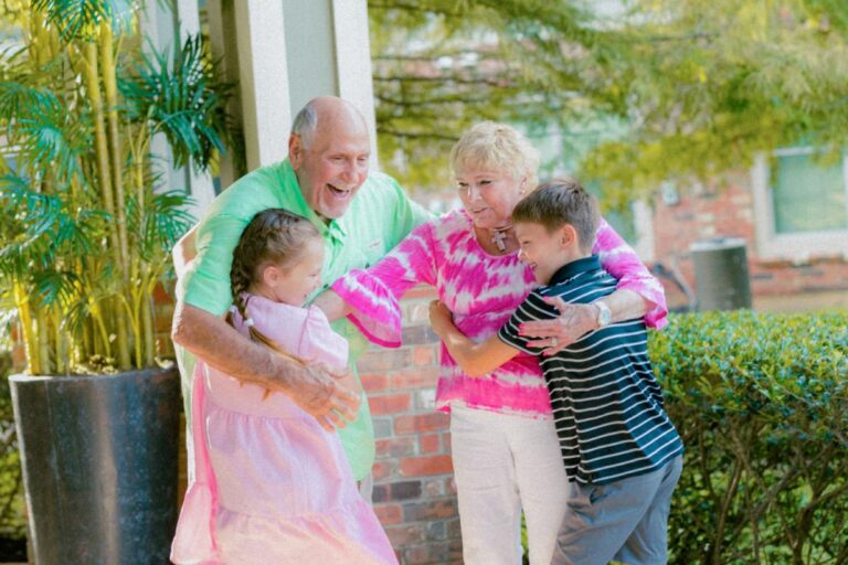 Civitas Senior Living | Senior couple hugging grandkids