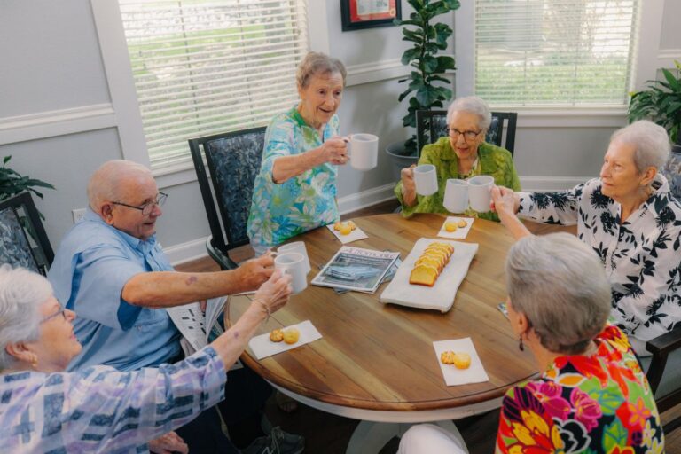 Civitas Senior Living | Seniors gathered around a table for a meal