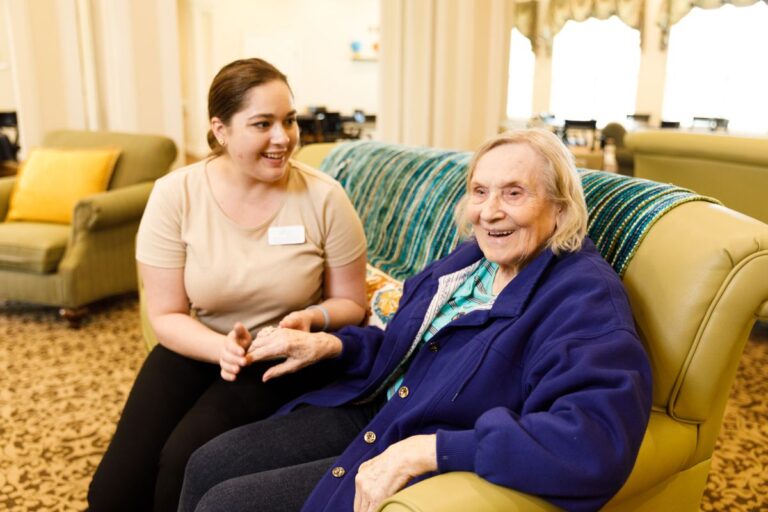 Civitas Senior Living | Senior woman sitting with caregiver