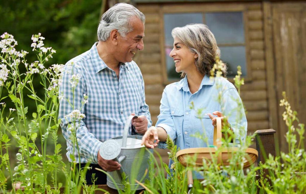 Arabella of Red Oak | Happy senior man and woman working in a garden