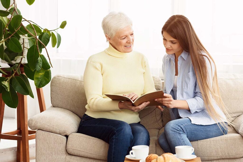 The Grand | Senior woman and her daughter looking at photots