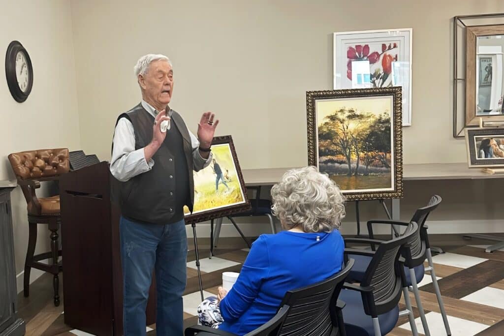 Civitas Senior Living | Resident showing his paintings