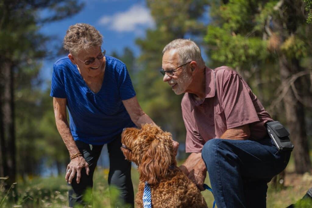 Civitas Senior Living | Senior couple walking with their dog